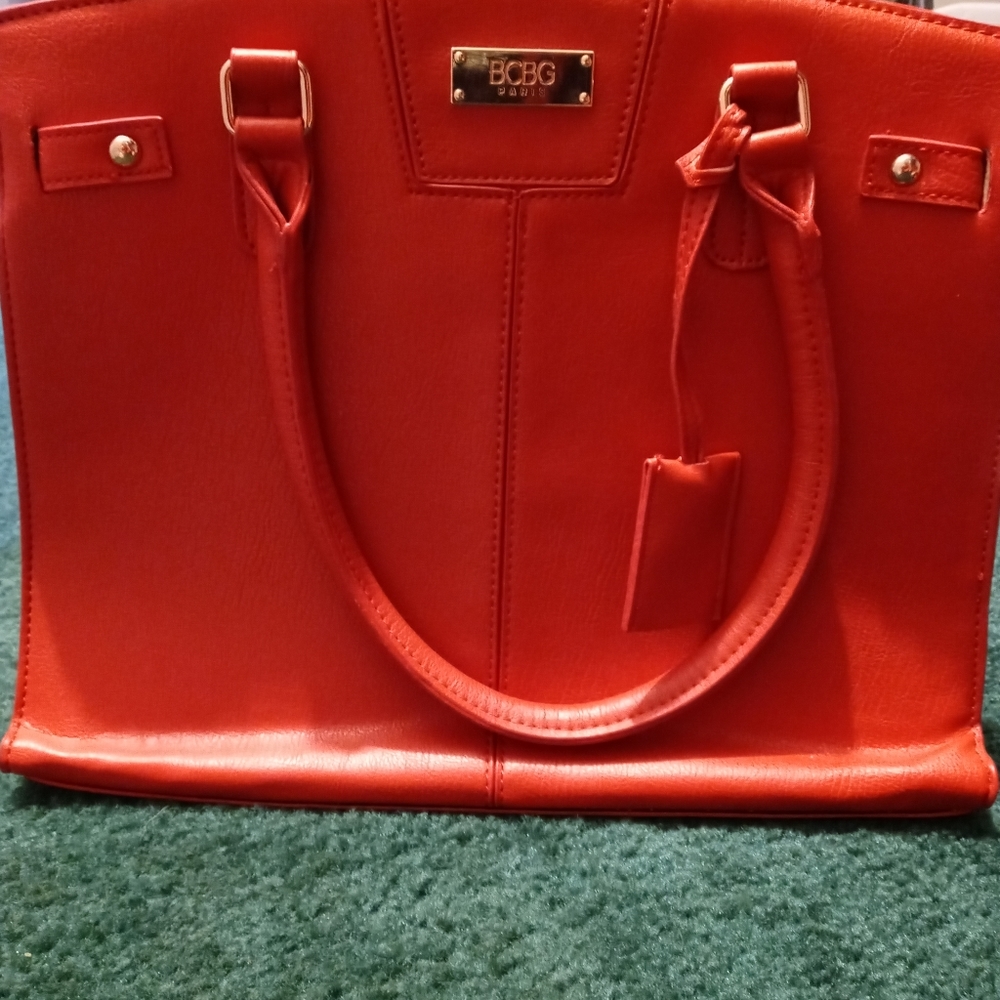 New in plastic BCBG red purse